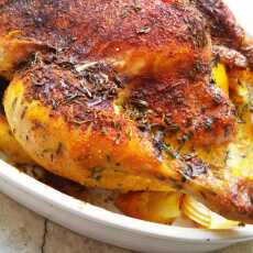 Przepis na Kurczak pieczony w maśle, tymianku i estragonie, nadziewany cytryną, cebulą i czosnkiem