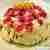Tort bezowy z pomarańczowym kremem mascarpone i polewą wiśniową