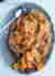 Kurczak zagrodowy pieczony na kapuście kiszonej z żurawiną, cebulą i jabłkiem